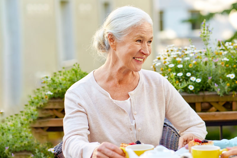 denture patient with implantsupported dentures eating lunch